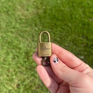 Louis Vuitton authentic gold lock and key number 300